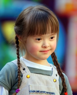 little girl with pig tails and overalls